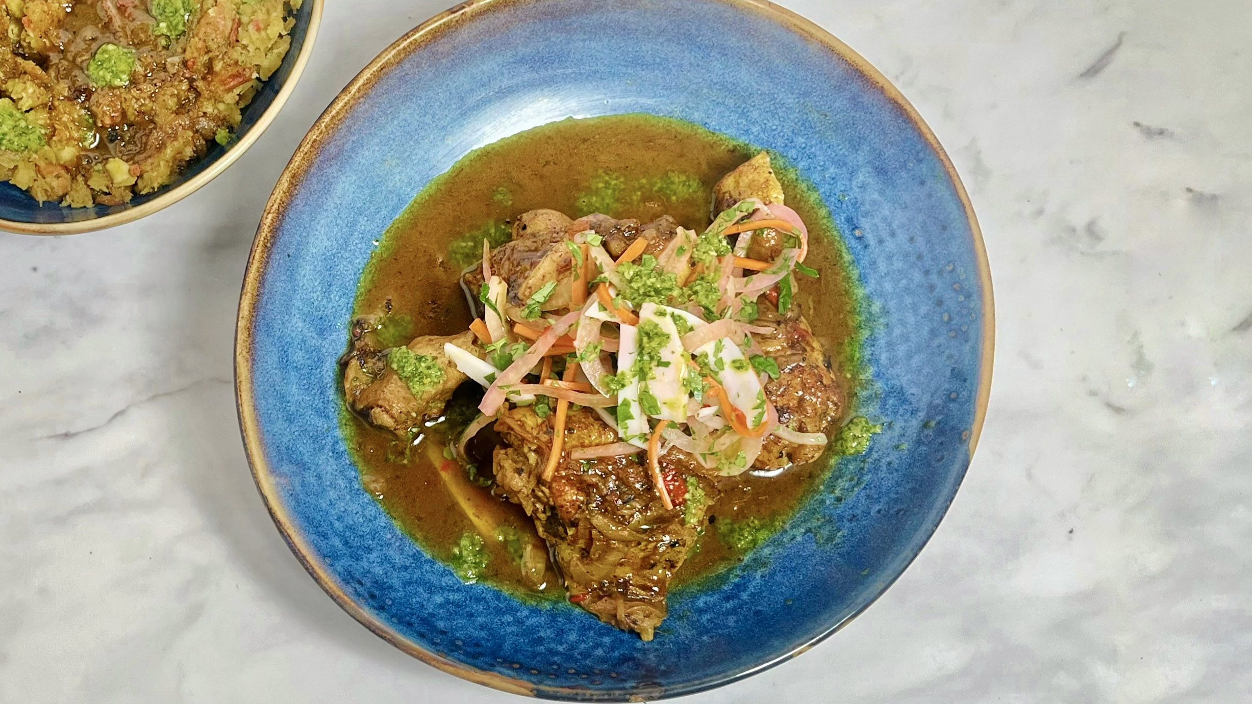 Curry chicken with escovitch pickle and mofongo-image