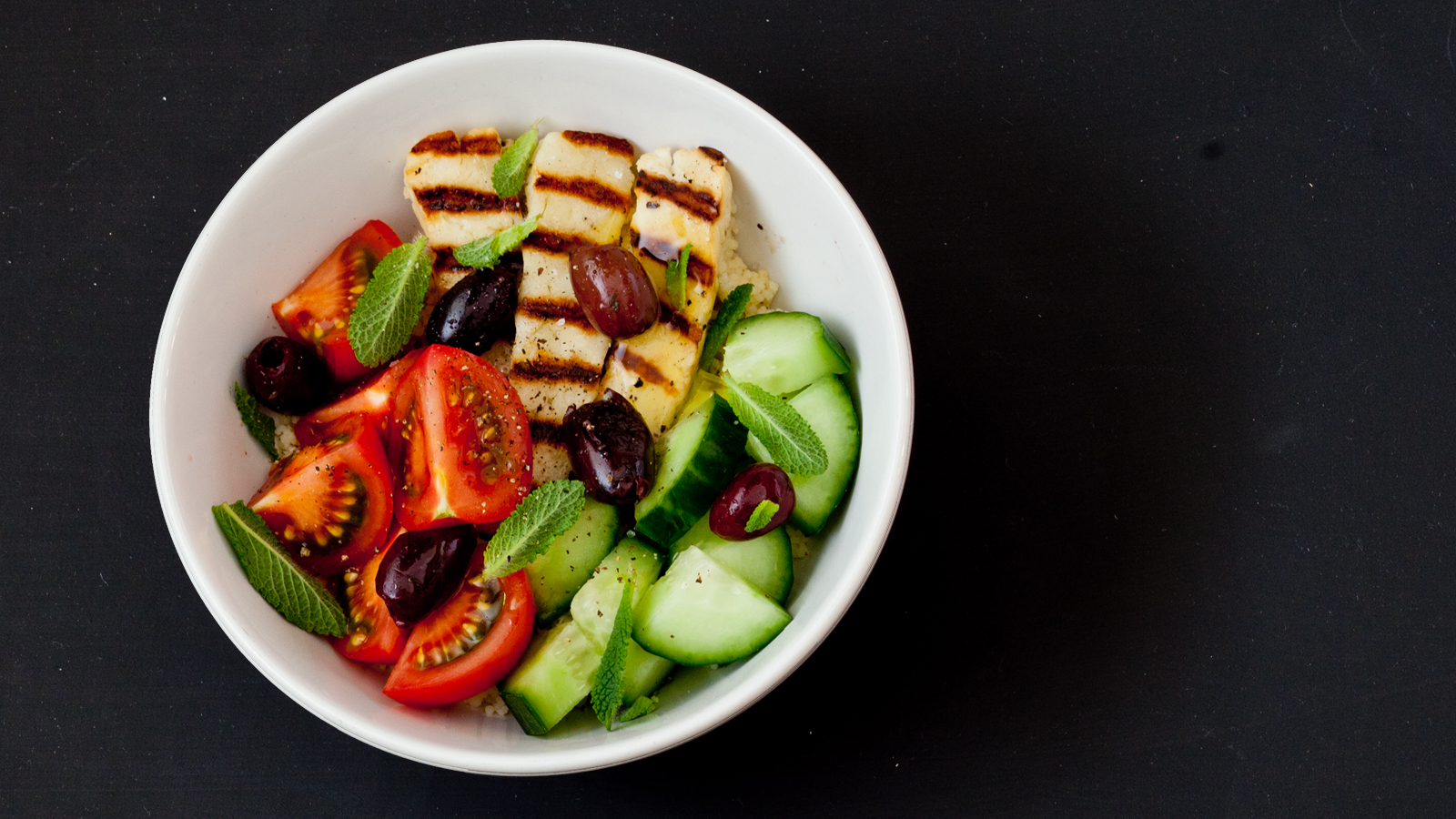 Halloumi, tomato, cucumber and couscous grain bowl-image