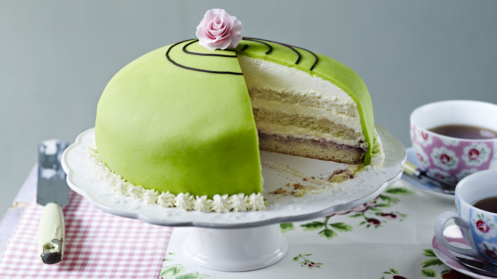 A Layer Cake Iced With Blue Fondant And Decorated With Marzipan Flowers,  Cut Open To Show The Centre Ornament by Adrian Britton - Pixels